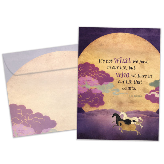 Front view of an All Occasion greeting card and matching envelope featuring horses running in front of the sun with a meaningful message about relationships over possessions.
