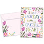Front view of an All Occasion greeting card and matching envelope with the message 'Start each day with a grateful heart' surrounded by delicate flowers.