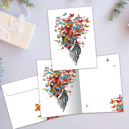 Front and inside view of an All Occasion greeting card showcasing a shell with butterflies in a joyful design, with a matching envelope.