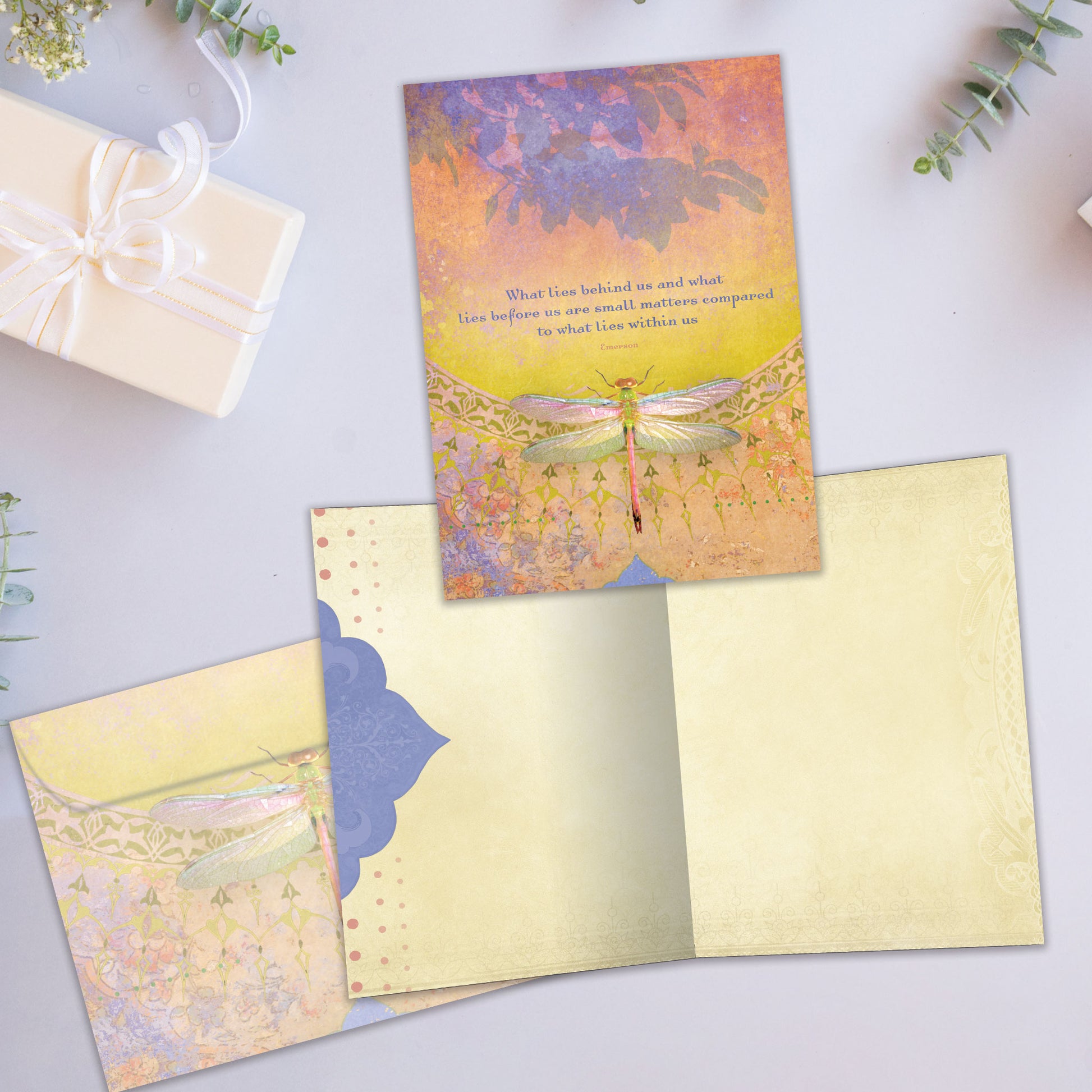 Front and inside view of an All Occasion greeting card showcasing a dragonfly on the cover with a message about inner strength, with a matching envelope.