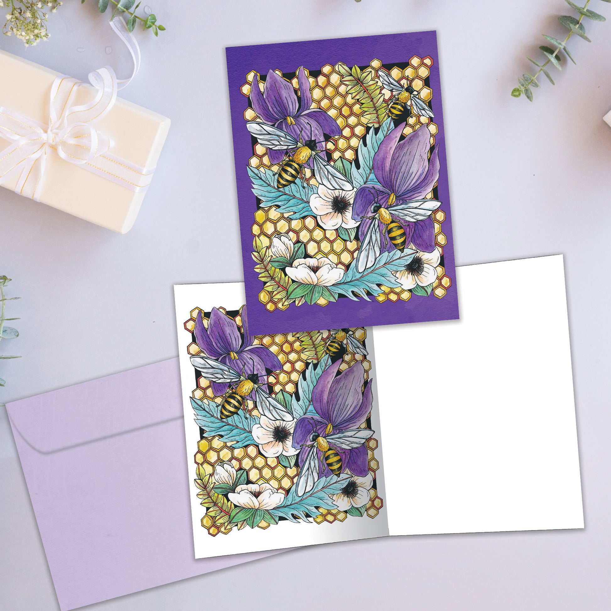 Front and inside view of an All Occasion greeting card showcasing honeycomb, bees, and flowers, with a matching envelope.