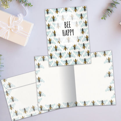 Front and inside view of an All Occasion greeting card showcasing bees and the message 'bee happy,' with a matching envelope.