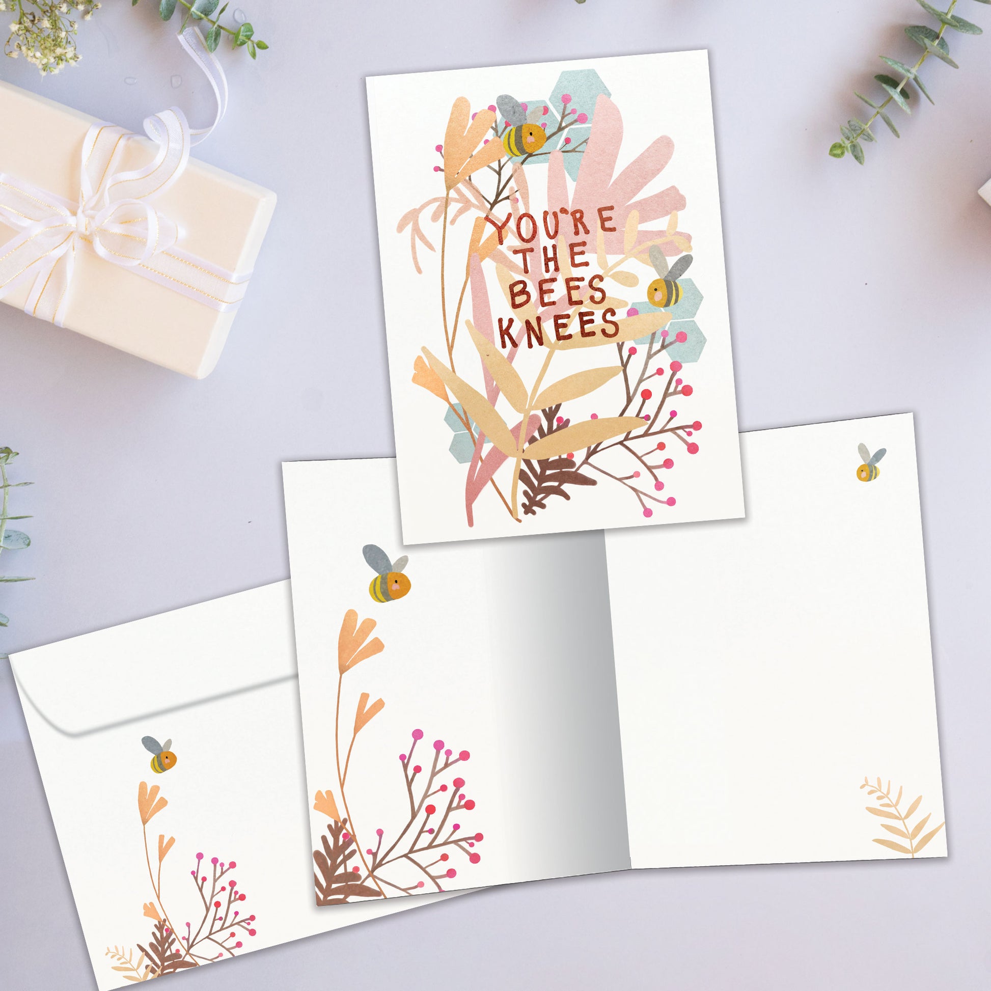 Front and inside view of an All Occasion greeting card showcasing bees with the message 'you're the bees knees,' with a matching envelope.