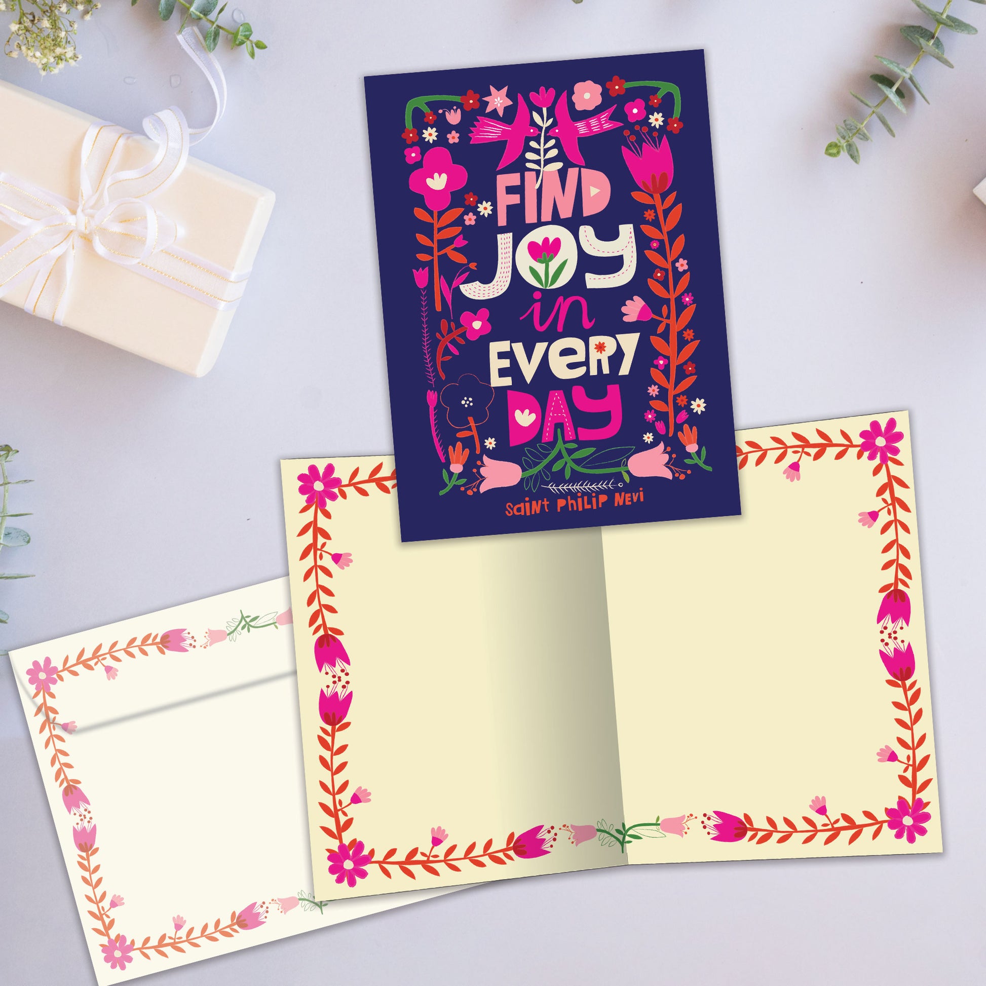 Front and inside view of an All Occasion greeting card showcasing a floral design and the message 'find joy in every day,' with a matching envelope.