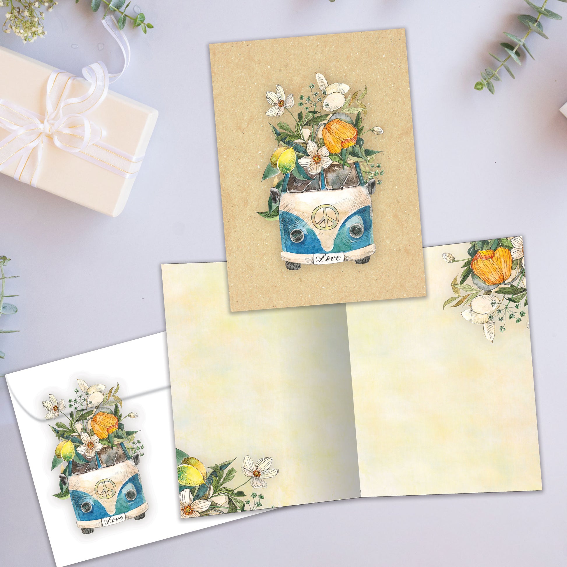Front and inside view of an All Occasion greeting card showcasing a van overflowing with flowers and the word 'Love' on the licence plate, with a matching envelope.
