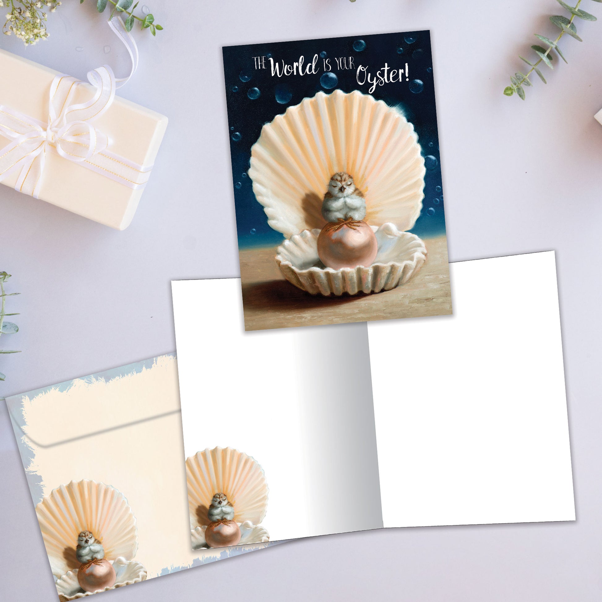 Front and inside view of an All Occasion greeting card featuring an oyster with a pearl illustration and joyful message, plus a matching envelope.