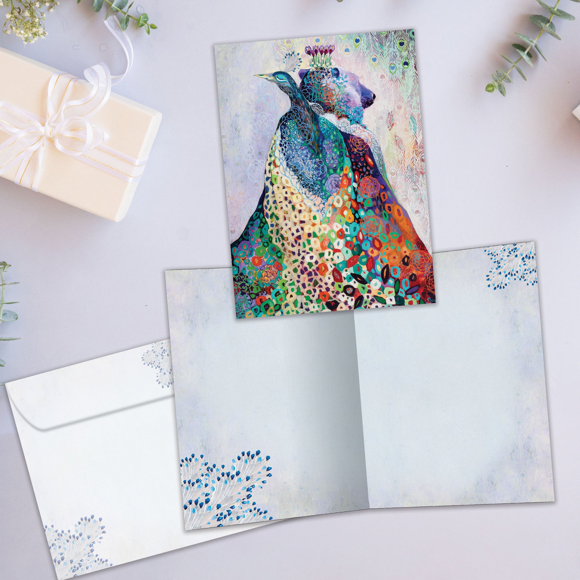 Front and inside view of an All Occasion greeting card featuring a peacock and bear illustration, plus a matching envelope.