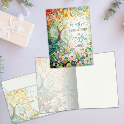 Front and inside view of an All Occasion greeting card featuring a tree and flowers illustration, plus a matching envelope.