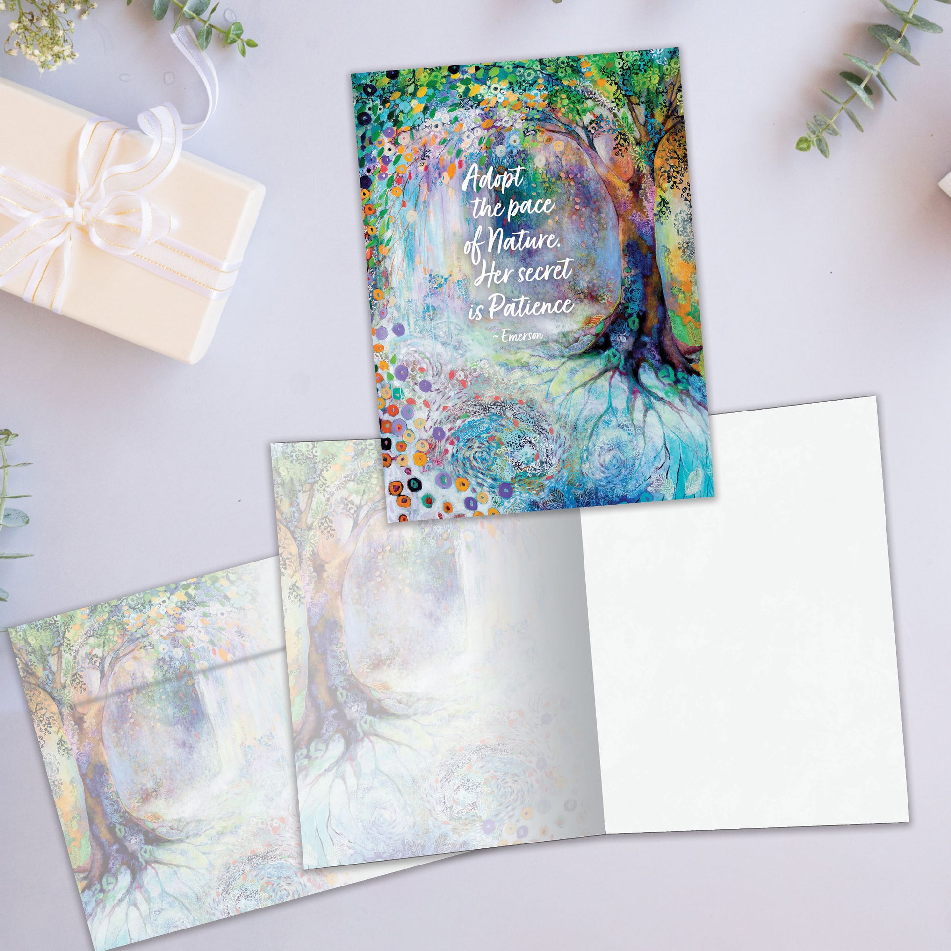Front and inside view of an All Occasion greeting card featuring a colourful tree and flowers illustration, plus a matching envelope.