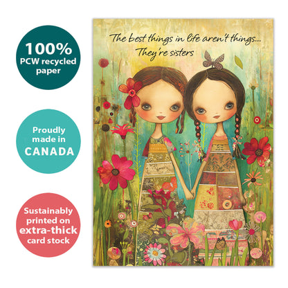 Front view of a Birthday greeting card with an illustration of two sisters holding hands surrounded by colorful flowers, highlighting its eco-friendly materials and made in Canada.