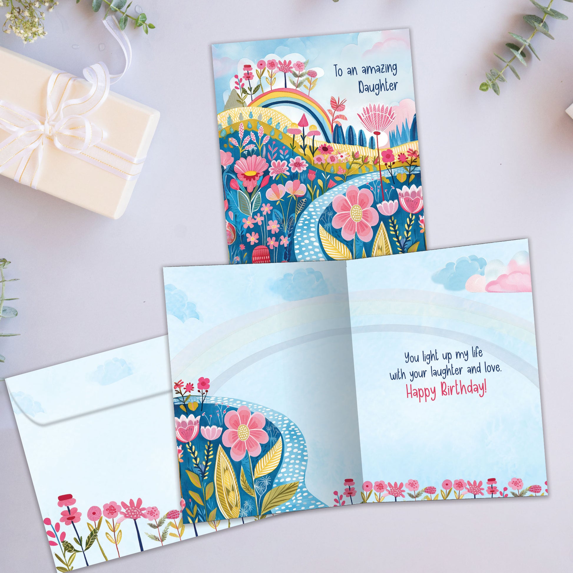 Front and inside view of a Birthday greeting card showcasing an illustration of colorful flowers with the message "To an amazing daughter," with a matching envelope.