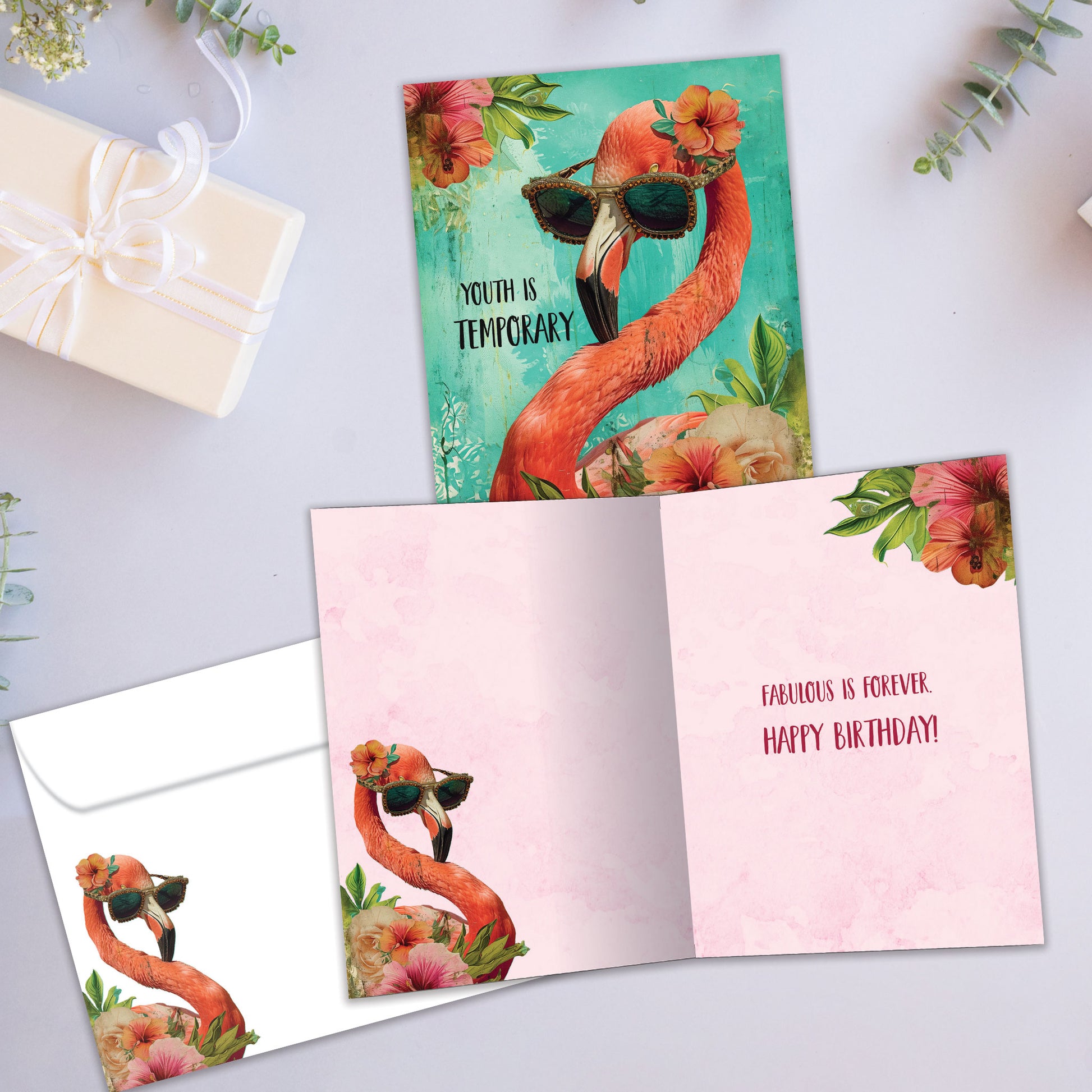 Front and inside view of a Birthday greeting card showcasing an illustration of a flamingo wearing sunglasses, with a matching envelope.