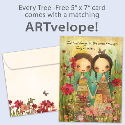 Front view of a Birthday greeting card featuring an illustration of two sisters holding hands surrounded by colorful flowers, with matching envelope artwork.