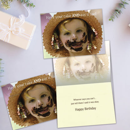 Front and inside view of a Birthday greeting card showcasing a close-up of a girl with cake on her face and a message about eating cake, with a matching envelope.