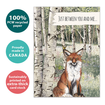 Front view of an eco-friendly All Occasion greeting card featuring a fox and the message 'just between you and me...', made sustainably in Canada.