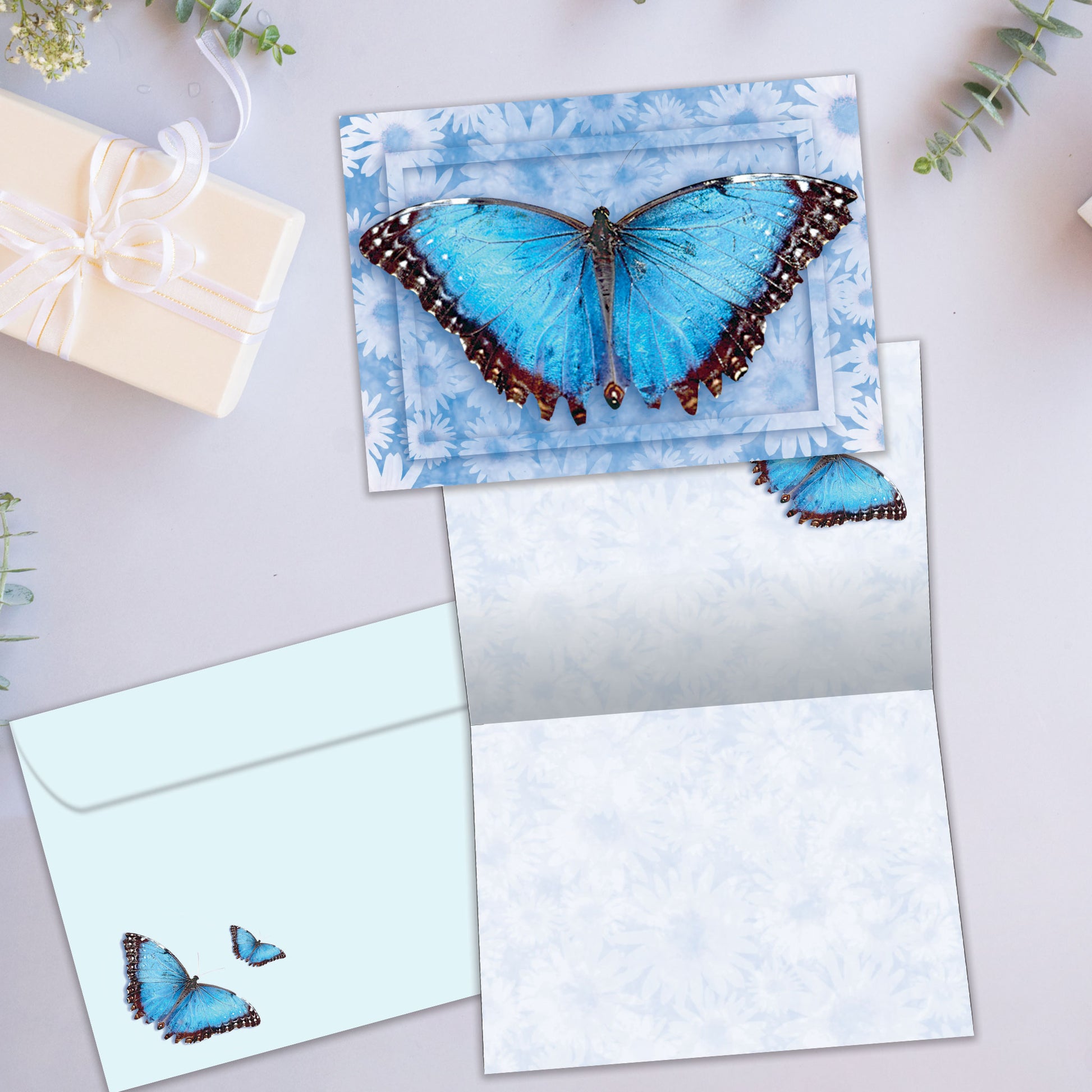 Front and inside view of an All Occasion greeting card showcasing a vibrant blue butterfly on a blue floral background with matching envelope design.