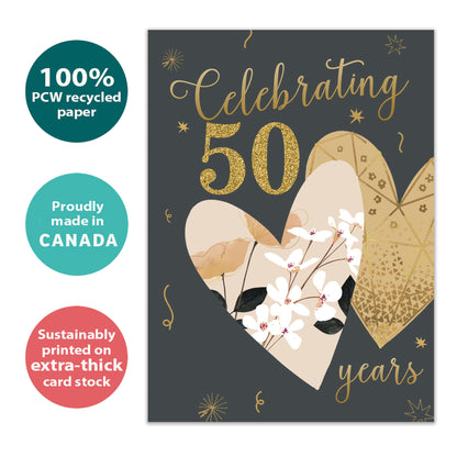 Front view of an Anniversary greeting card with "Celebrating 50 years" in gold on a dark background with two hearts, highlighting its eco-friendly materials and made in Canada.
