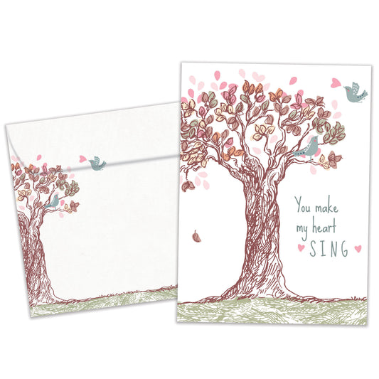 Front view of an Anniversary greeting card and matching envelope featuring a tree illustration and the message "you make my heart sing."