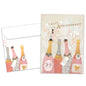 Front view of an Anniversary greeting card and matching envelope featuring champagne bottles with the words "Happy Anniversary."