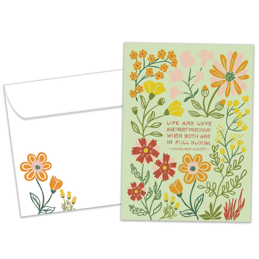 Front view of an Anniversary greeting card and matching envelope featuring a floral design on a light green background with a message