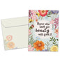 Front view of an Anniversary greeting card and matching envelope featuring a message about finding beauty surrounded by floral artwork.