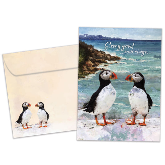 Front view of an Anniversary greeting card and matching envelope featuring two puffins by the ocean with a heartfelt message.