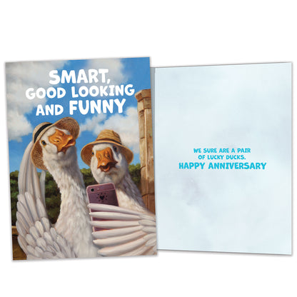 Front and inside view of an Anniversary greeting card featuring a duck couple taking a selfie, with matching design details inside.