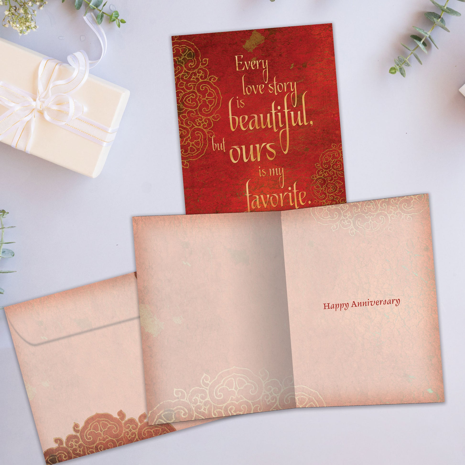 Front and inside view of an Anniversary greeting card showcasing a red cover with a love message, with a matching envelope.