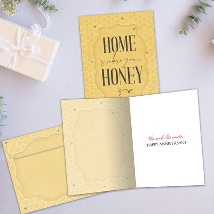 Front and inside view of an Anniversary greeting card showcasing a golden honeycomb background and a nice message, with a matching envelope.