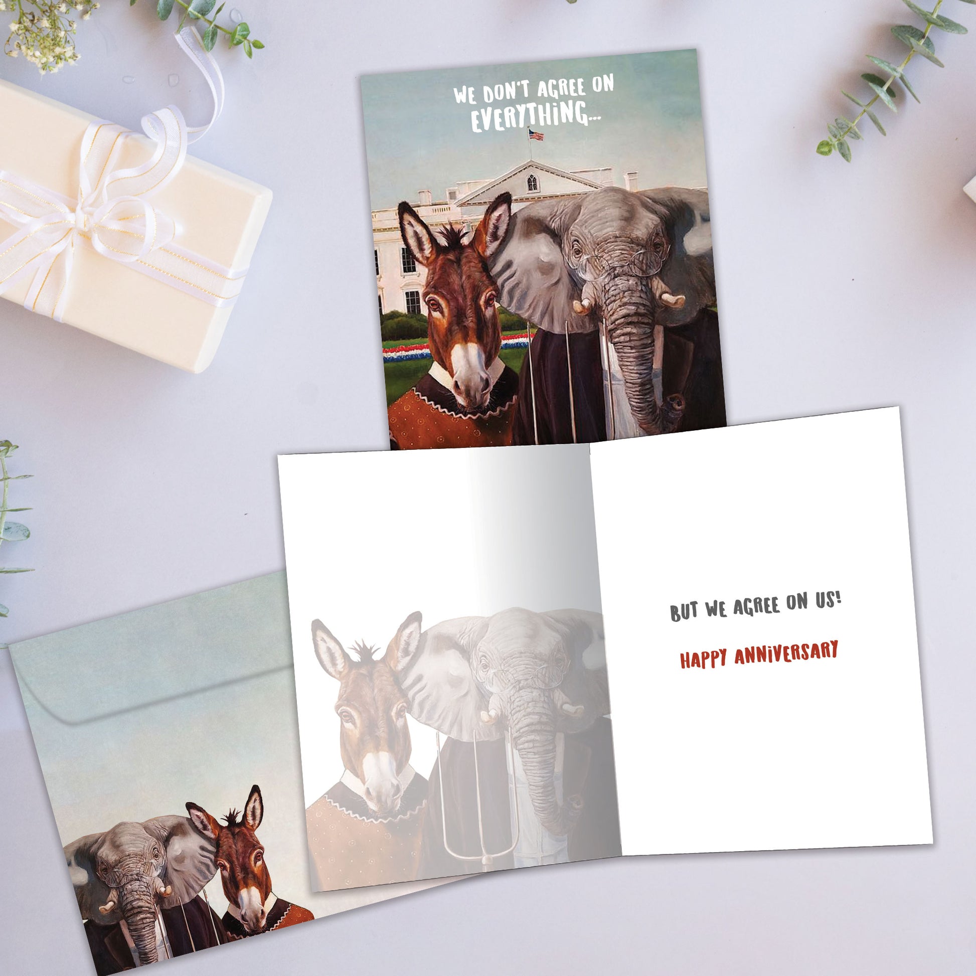 Front and inside view of an Anniversary greeting card showcasing a humorous mule and elephant couple illustration, with a matching envelope.