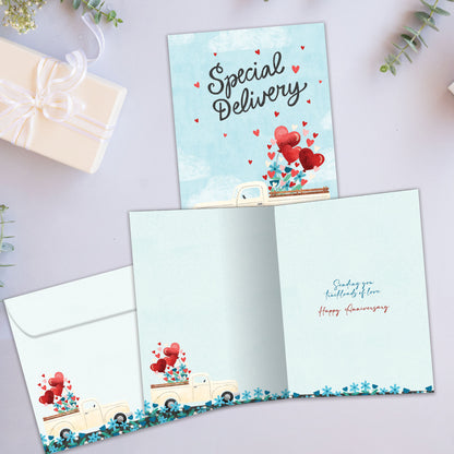 Front and inside view of an Anniversary greeting card showcasing a truck filled with hearts and the message "Special Delivery," with a matching envelope.