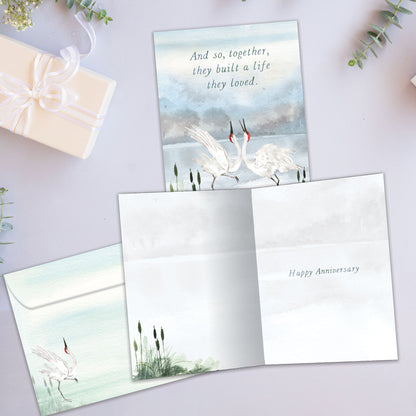 Front and inside view of an Anniversary greeting card showcasing two dancing cranes in a graceful pose, with a matching envelope.