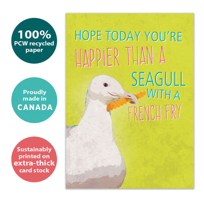 Front view of a Birthday greeting card with an illustration of a seagull holding a french fry, highlighting its eco-friendly materials and made in Canada.