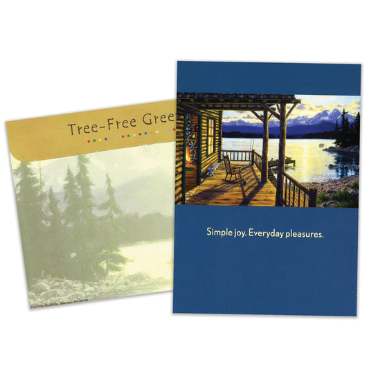 Front view of a Birthday greeting card featuring a porch with a peaceful lake and mountain scene, with a matching envelope.