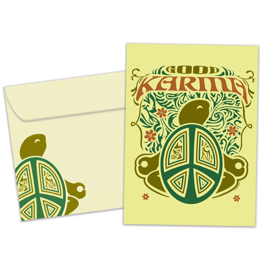 Front view of a Birthday greeting card and matching envelope featuring a green illustration of a turtle with the words "Good Karma."