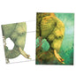 Front view of a Birthday greeting card and matching envelope featuring a cheerful illustration of an elephant with musical notes on a light green background.