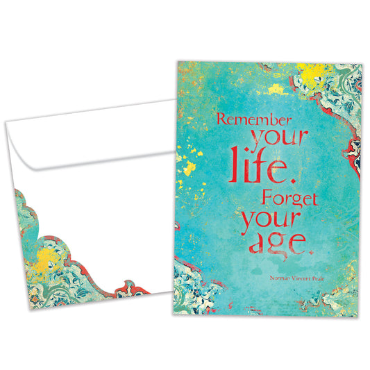 Front view of a Birthday greeting card and matching envelope featuring a message about life and aging on an artistic blue background.