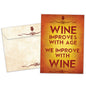 Front view of a Birthday greeting card and matching envelope featuring the message "Wine improves with age, we improve with wine."