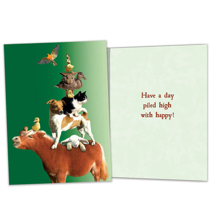 Front and inside view of a Birthday greeting card featuring animals piled on a mule on a green background, with matching design details inside.