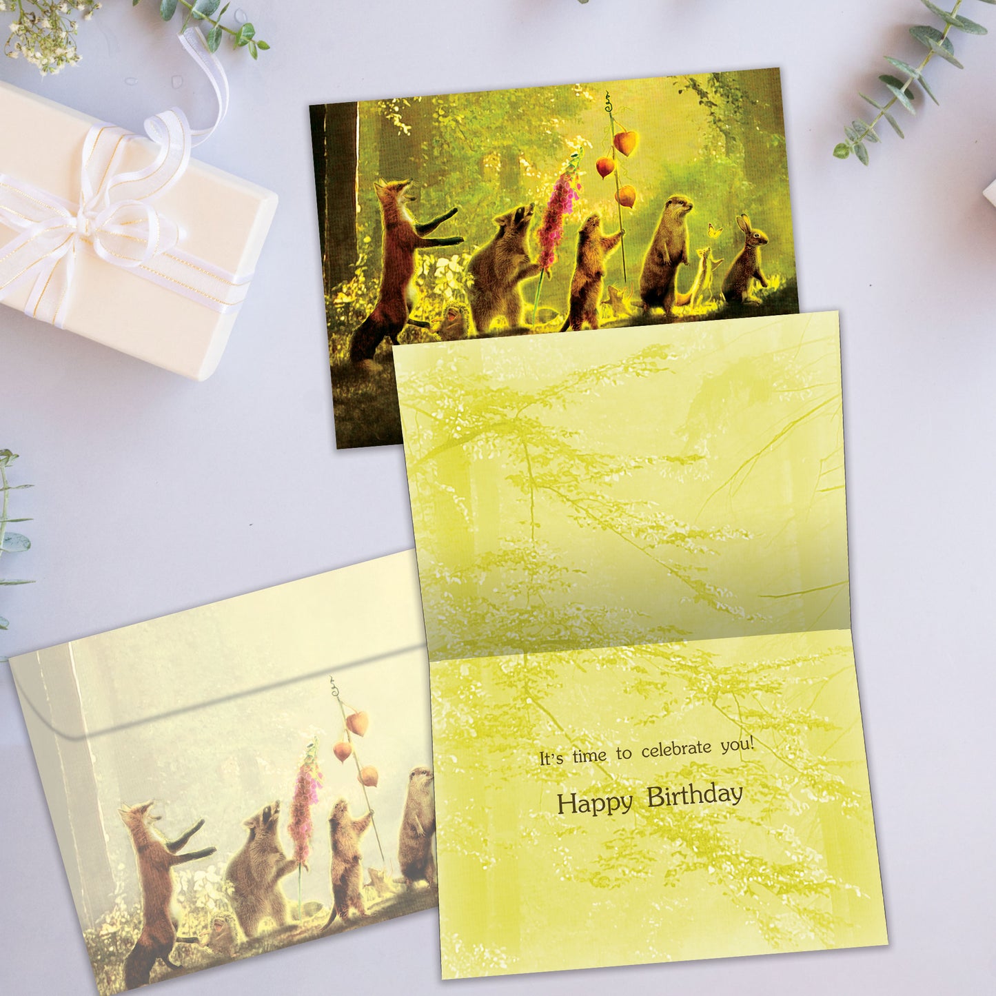 Front and inside view of a Birthday greeting card showcasing a lively parade of forest animals, complete with a joyful message and a matching envelope.