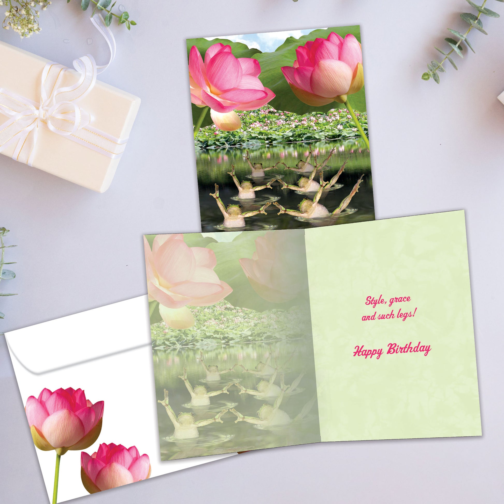 Front and inside view of a Birthday greeting card showcasing frogs in a pond doing synchronized swimming, with a matching envelope.