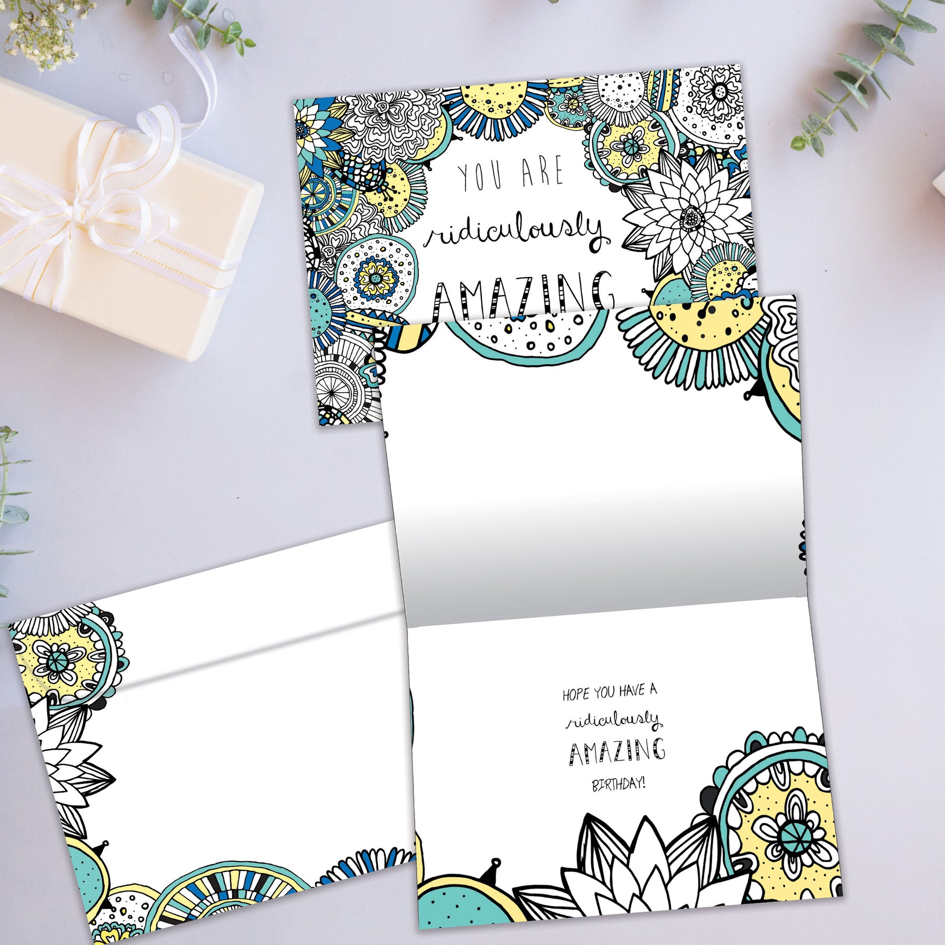 Front and inside view of a Birthday greeting card showcasing the message "You are ridiculously amazing," with a matching envelope.