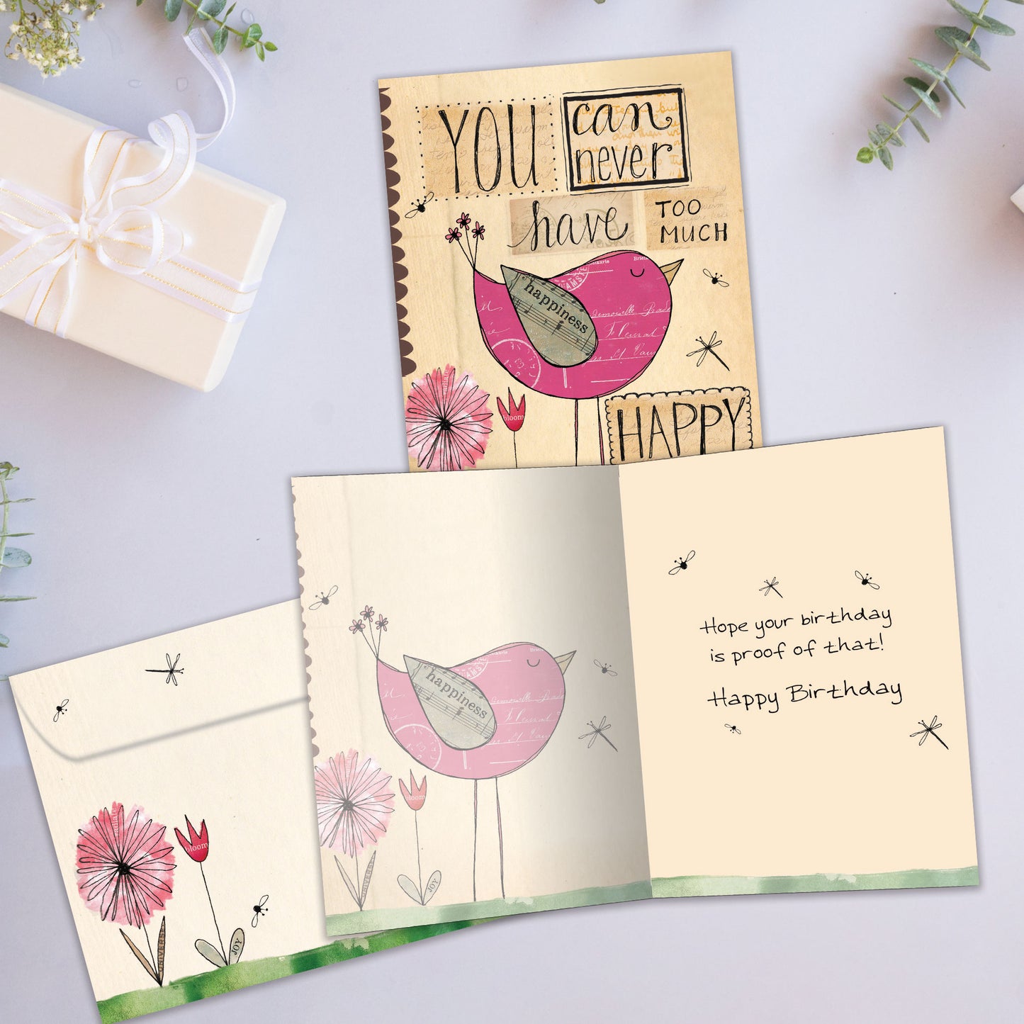 Front and inside view of a Birthday greeting card showcasing a happy bird and a cheerful message, with a matching envelope.