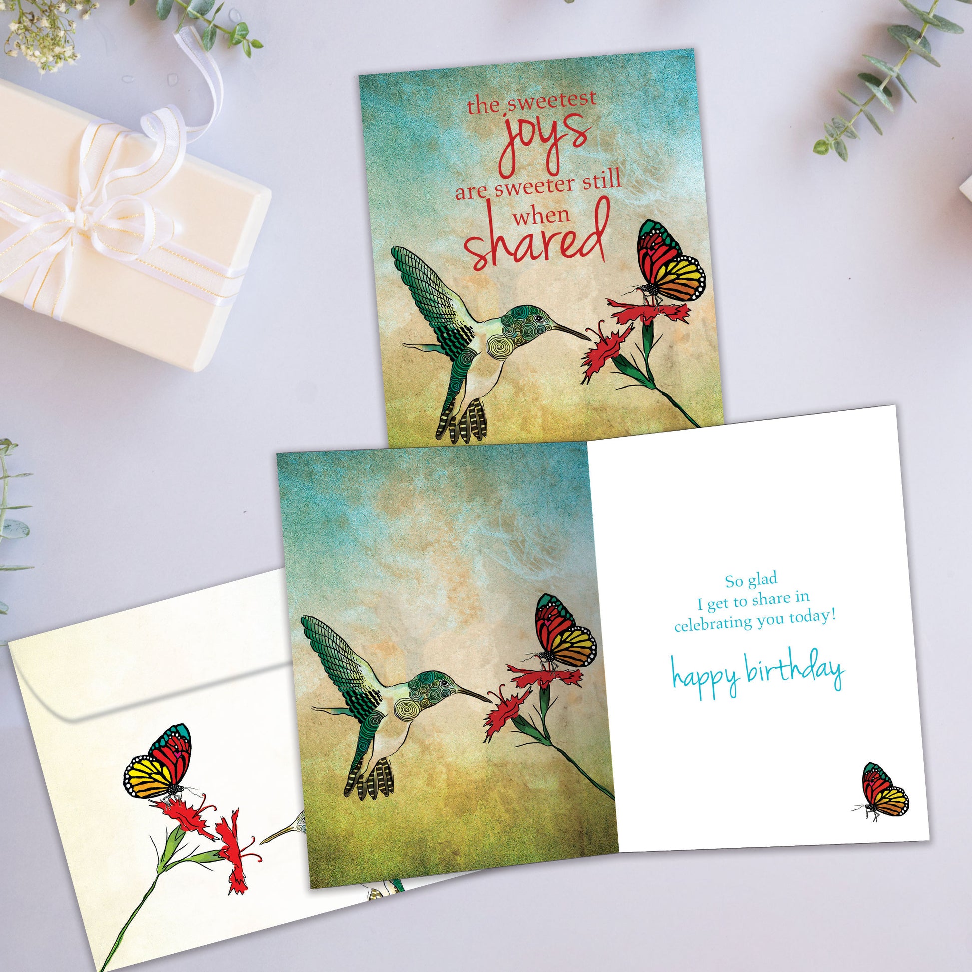 Front and inside view of a Birthday greeting card showcasing a bird, flower, and butterfly illustration with a nice message, with a matching envelope.