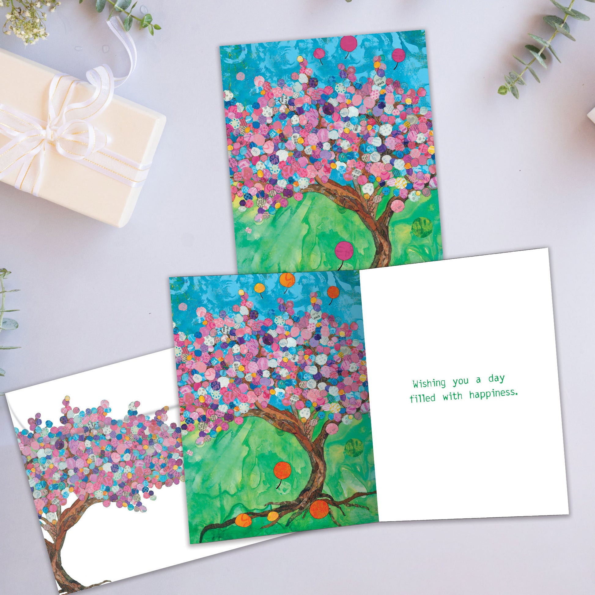 Front and inside view of a Birthday greeting card showcasing a balloon tree illustration, with a matching envelope.